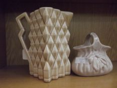 Falcon ware jug together with a ceramic basket
