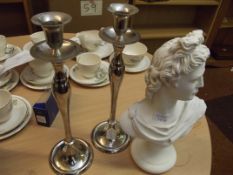 Plaster bust together with a pair of plated candle
