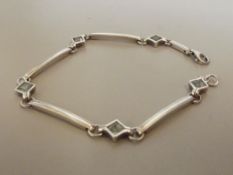 Silver stamped bracelet with 5 stones