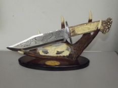 Native American style dagger on a display stand