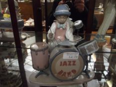 Lladro figure of a drummer, one drumstick loose