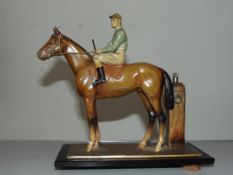 Metal figure of a jockey and horse