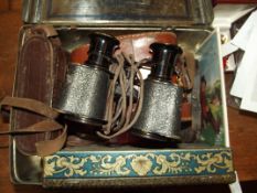 Tin containing vintage track and opera glasses