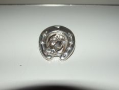 Silver stamped brooch, horseshoe