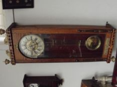 Oak cased Vienna wall clock