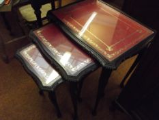 Nest of three tables, glazed and inset with tooled
