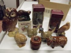 Collection of ten novelty whisky decanters, some s