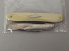 Silver pen knife and one other