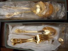 Two boxes of gold plated flatware