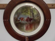 Round framed ceramic plaque, Cattle scene. Signed