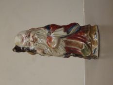 Oriental ceramic god figure