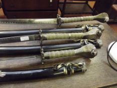 Three graduating Samurai display swords