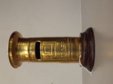 Brass money box in the form of a post box