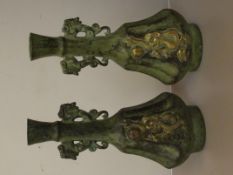Pair of bronze vases with embossed dragon decorati