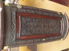 Georgian corner cupboard with carved decoration