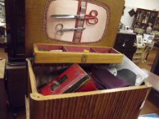 Sewing box and contents on splayed legs