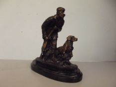 Bronze group. farmer and dog hunting