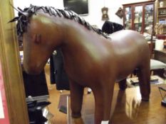 Leather footstool in the form of a horse