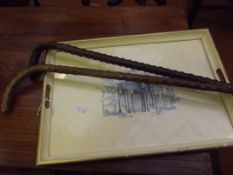 Two walking sticks together with a serving tray