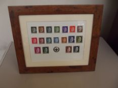 Framed German stamps and badge