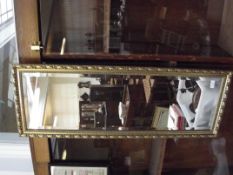 Gilt framed bevelled mirror