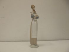 Lladro figure of a girl with lamb