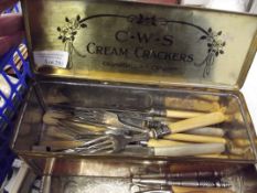 CWS tin containing flatware together with a plated