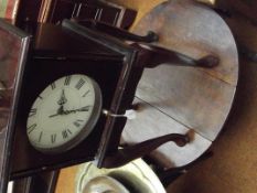 Table clock together with a drop leaf table