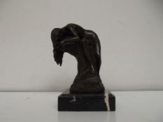 Bronze nude on tree, signed