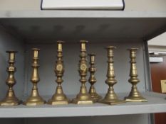 4 pairs of brass candle sticks