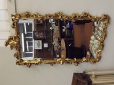 Ornate gilt framed mirror