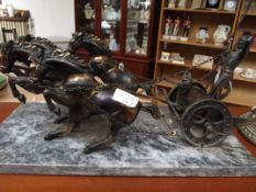 Metal chariot on a marble base