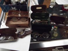 Collection of 8 cased vintage spectacles