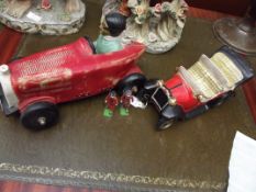 Two ceramic cars together with two Britain beefeat