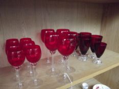 Shelf of red glassware