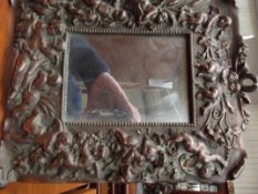 Spelter mirror with cherub border