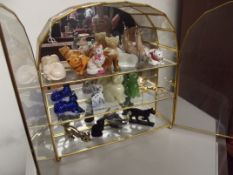 Cased collection of model cats.