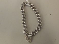 Silver bracelet with hear locket