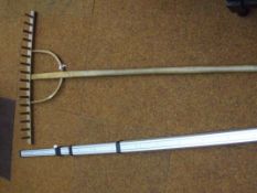 Vintage wooden rake and 500 cm measuring stick