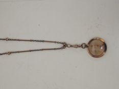 A ladies muff/guard chain necklace with decorative