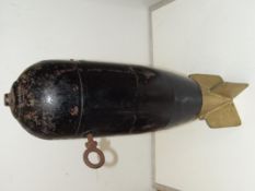 A heavy WWII empty shell case