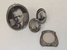 A collection of photograph frames, to include an E