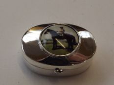 Silver stamped enamel pill box, horse and jockey