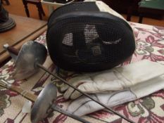 Two Leon Paul fencing foils with gloves and mask
