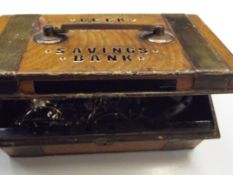 Metal savings bank tin of costume jewellery