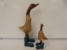 Wooden duck in hunter boots