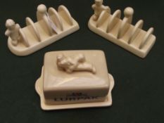 Two lurpak toast rack and a lurpak butter dish