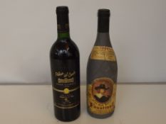 Bottle of Faustino and bottle of Gran Reserva, sea