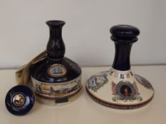 Two decanters of British navy rum, empty bottles