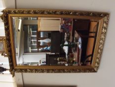 Gilt framed bevelled mirror